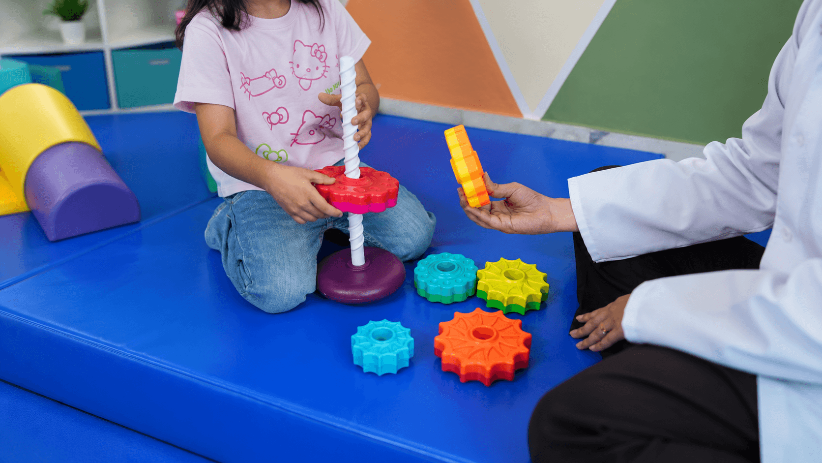 Children playing with colorful toys at The Milestone Centre